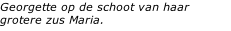 Georgette op de schoot van haar grotere zus Maria.